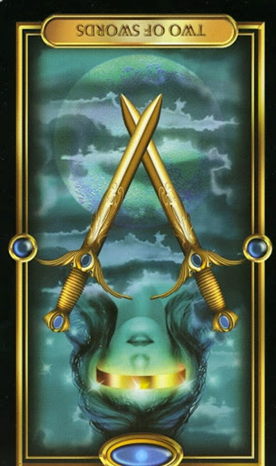 reversed two of swords gilded tarot